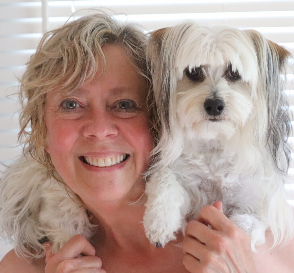 Cheri with her dog Candy on her shoulders