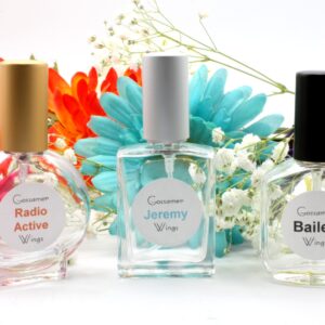 Three perfume bottles, 2 of them with people's names on them, Radio Active, Jeremy, Bailey