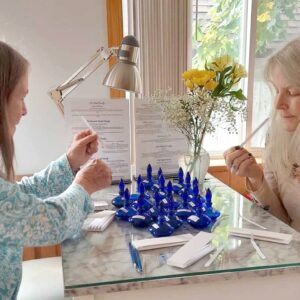 Two women designing a perfume at the DIY Perfume Blending Bar